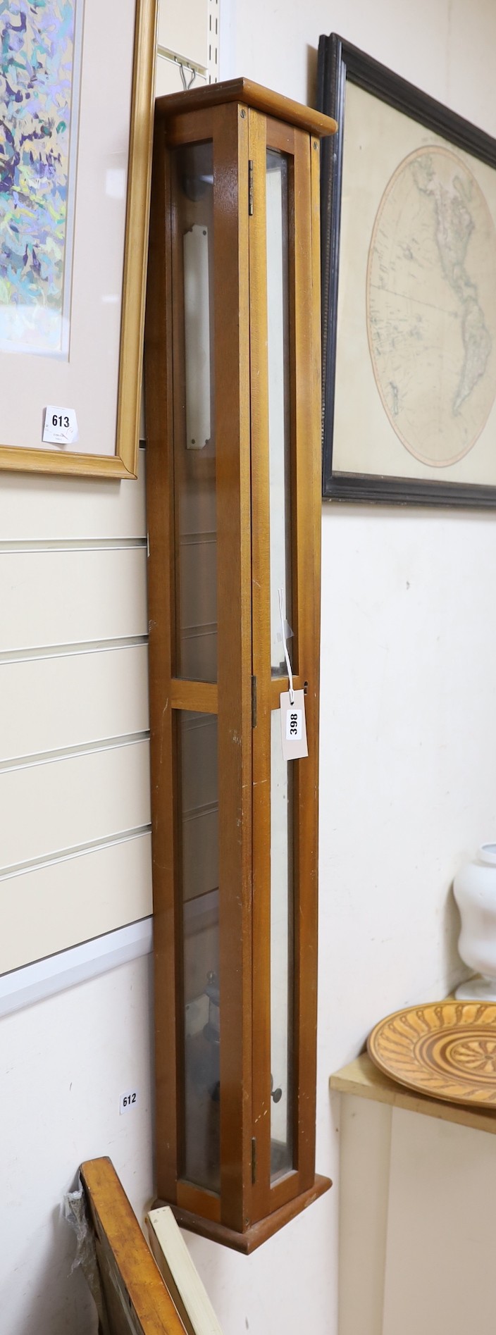 A marine barometer in a mahogany case, 118x17cm